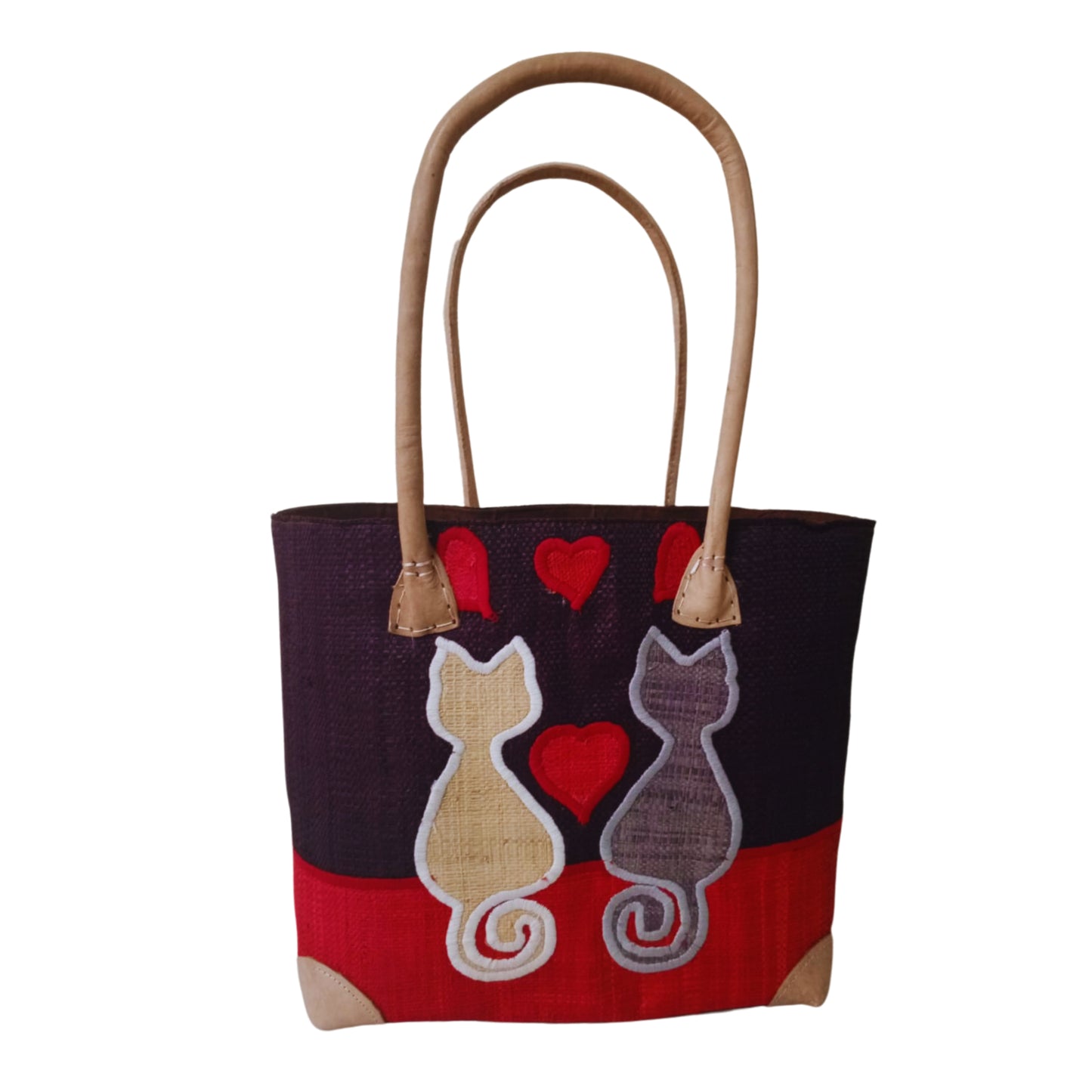 Woven baskets with cat embroidery, leather handle and drawstring closure. Handmade in Madagascar