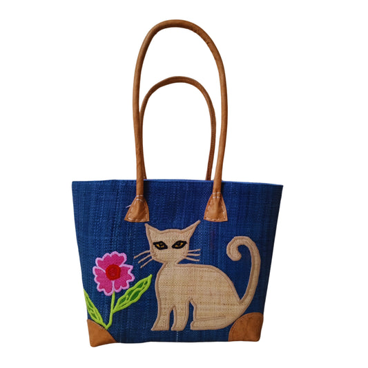 Blue woven basket with cat embroidery, leather handle and drawstring closure. handmade in Madagascar. 