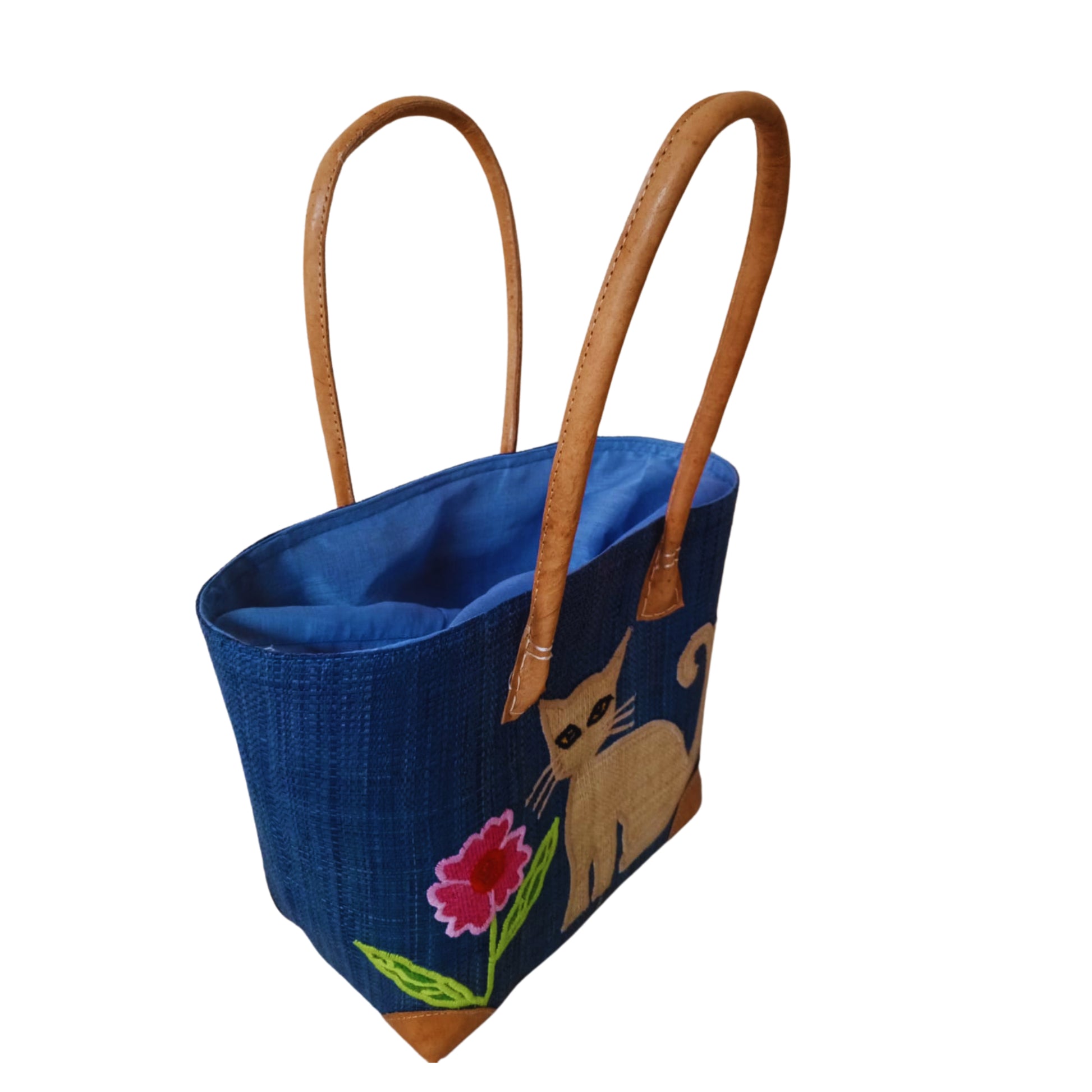 Blue woven basket with cat embroidery, leather handle and drawstring closure. handmade in Madagascar. 