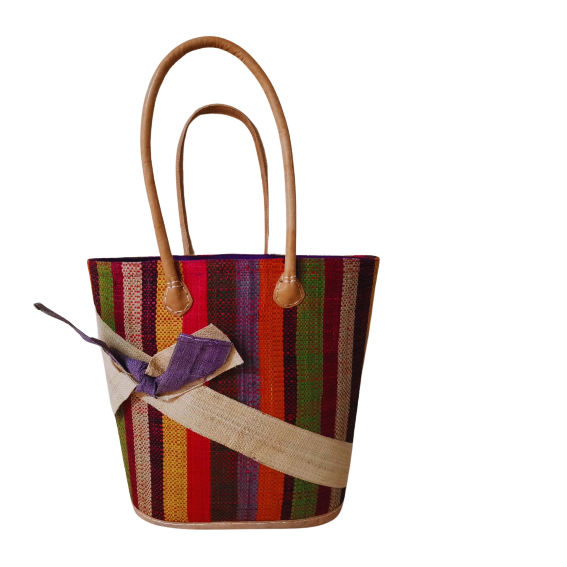 Beige and Brown woven basket with a raffia bow. Handmade in Madagascar. 