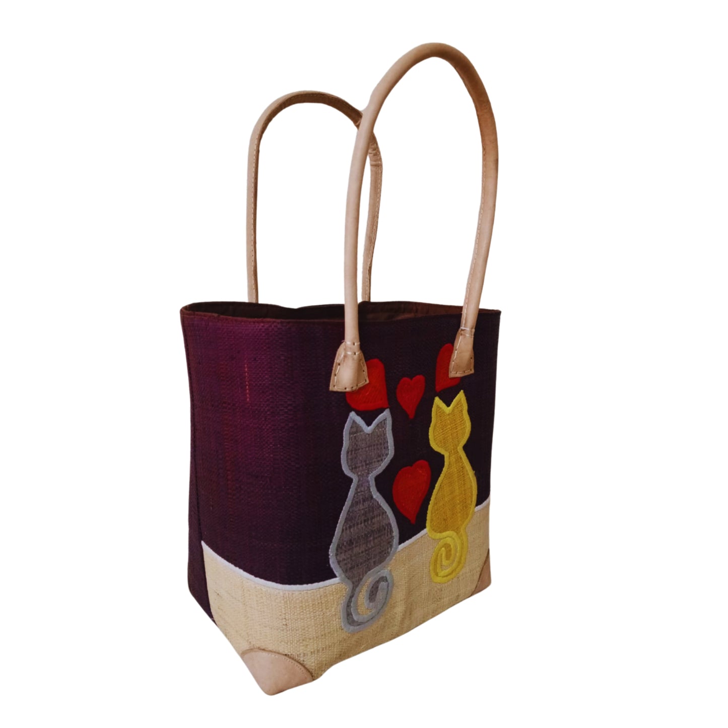 Woven baskets with cat embroidery, leather handle and drawstring closure. Handmade in Madagascar