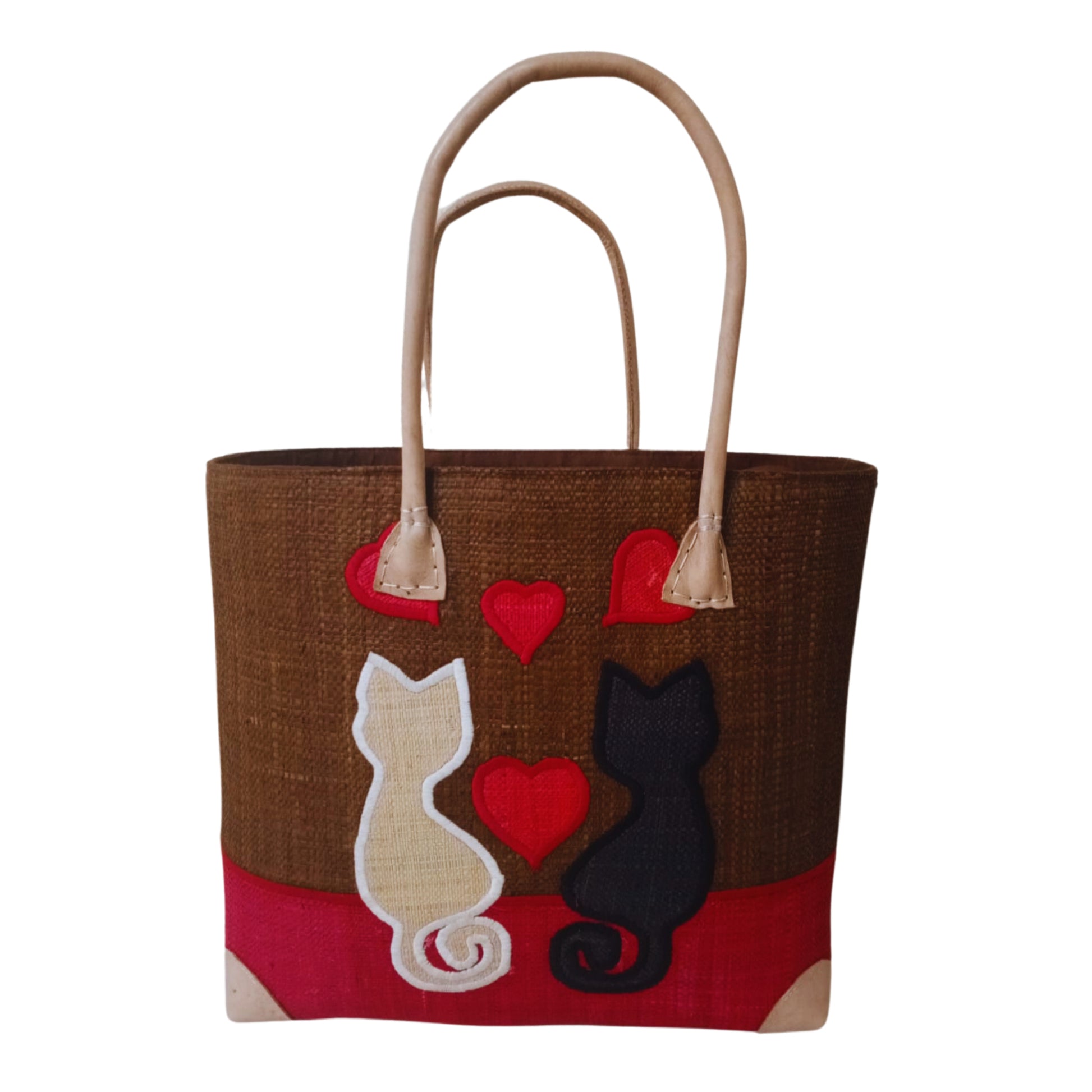 Woven baskets with cat embroidery, leather handle and drawstring closure. Handmade in Madagascar