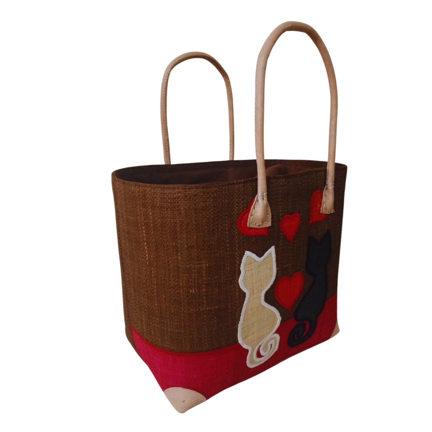 Woven baskets with cat embroidery, leather handle and drawstring closure. Handmade in Madagascar