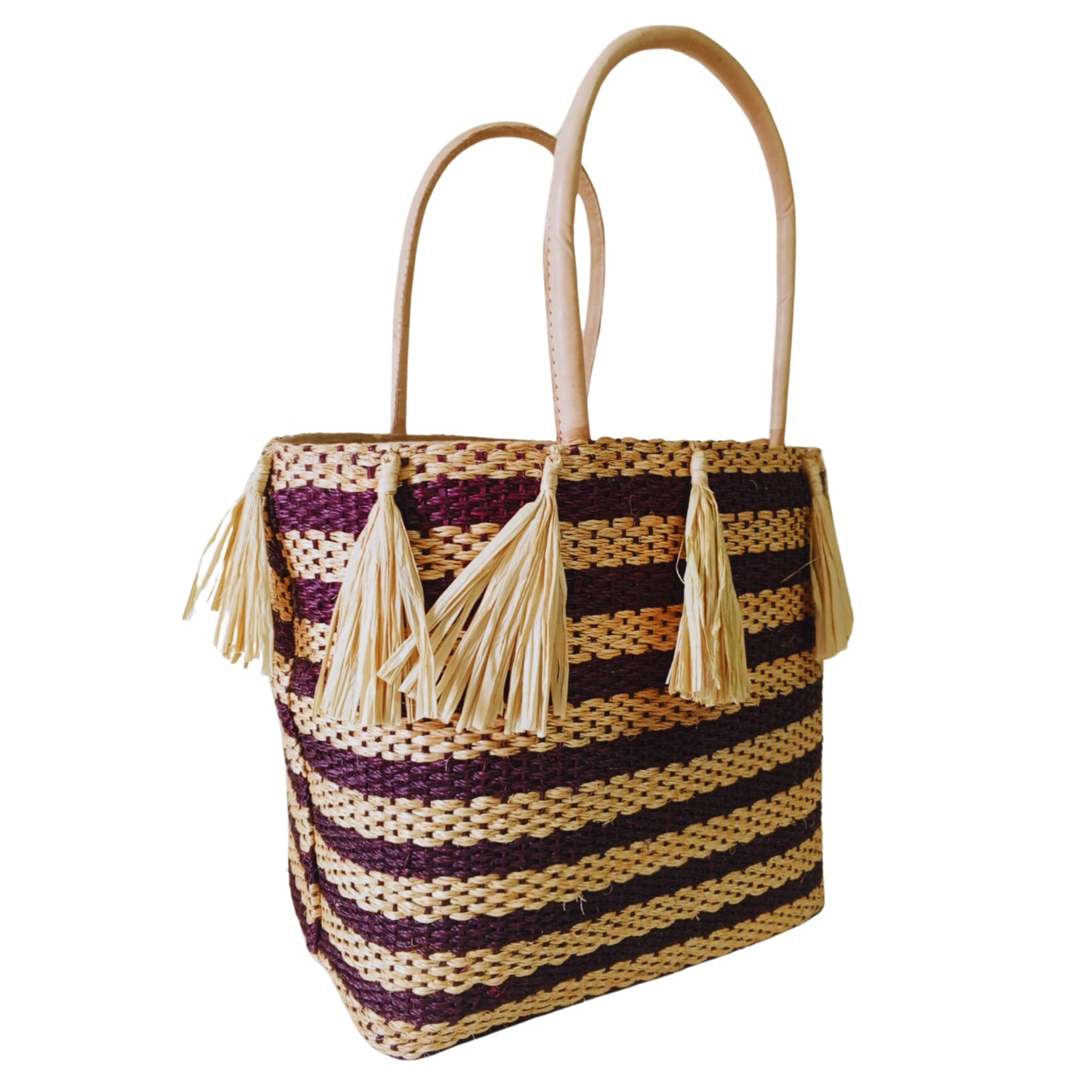 Brown handmade woven basket with tassel. Leather handle and drawstring closure. Handmade in Madagascar 