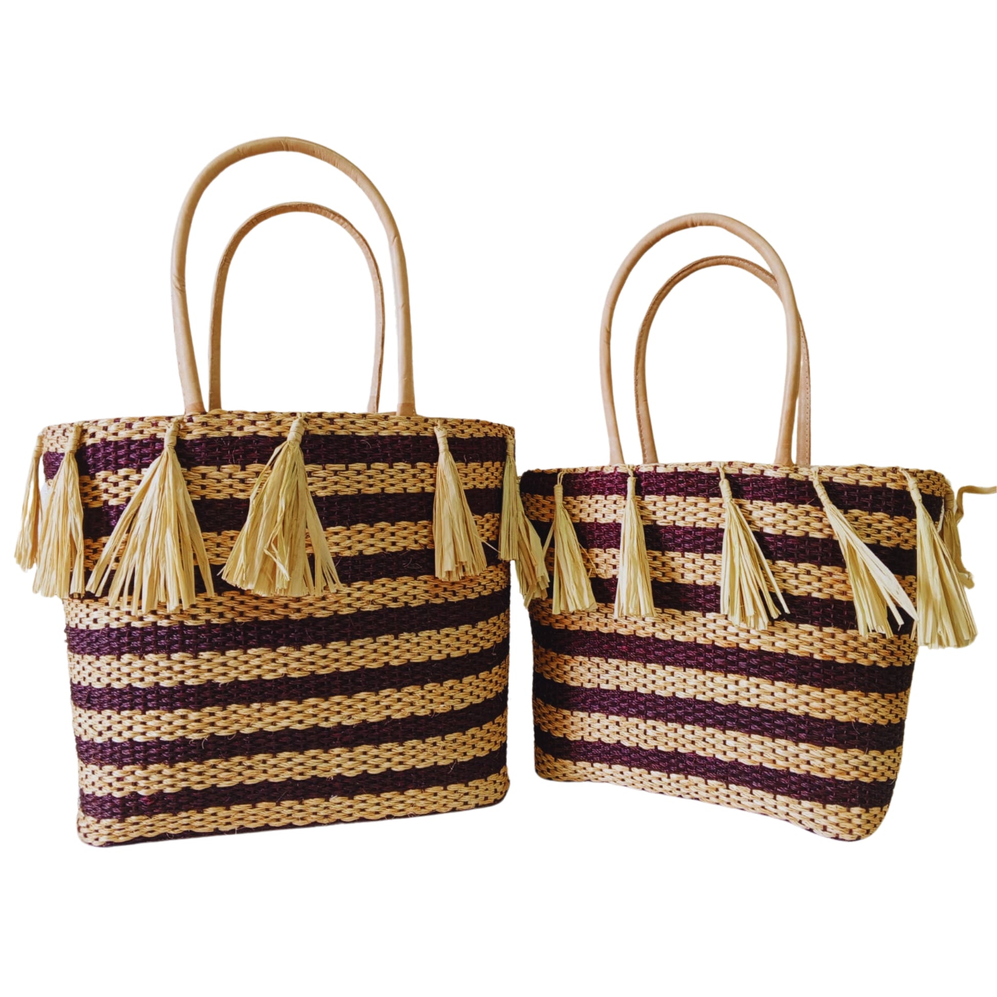 Brown handmade woven basket with tassel. Leather handle and drawstring closure. Handmade in Madagascar 