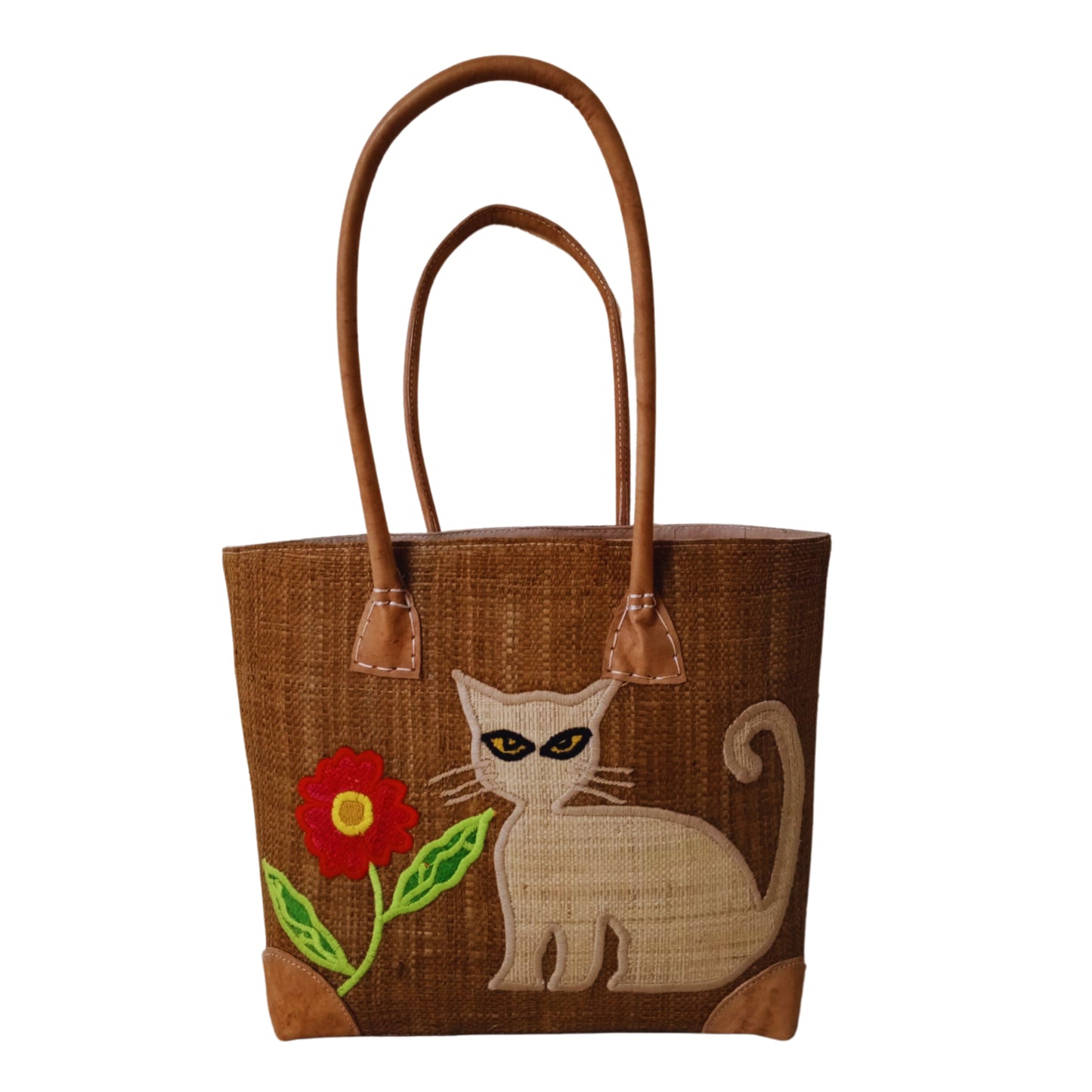 Brown woven basket with cat embroidery, leather handle and drawstring closure. handmade in Madagascar. 