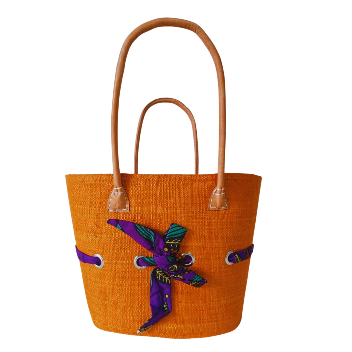 Orange raffia woven basket with a fabric bow tied features. Handmade in Madagascar