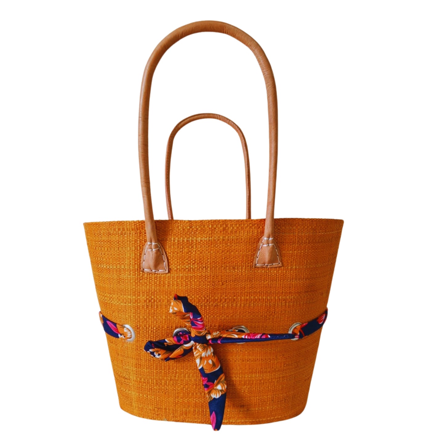 Orange raffia woven basket with a fabric bow tied features. Handmade in Madagascar