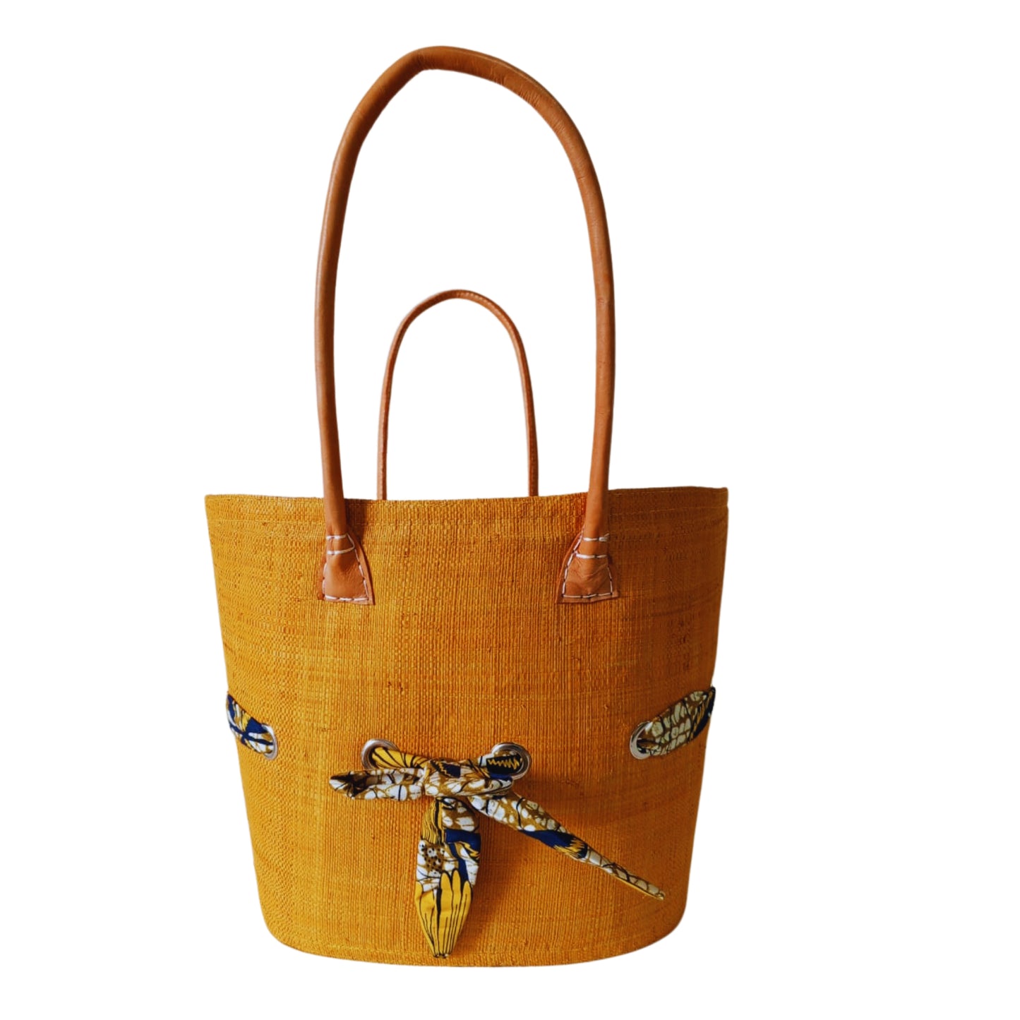 Orange raffia woven basket with a fabric bow tied features. Handmade in Madagascar