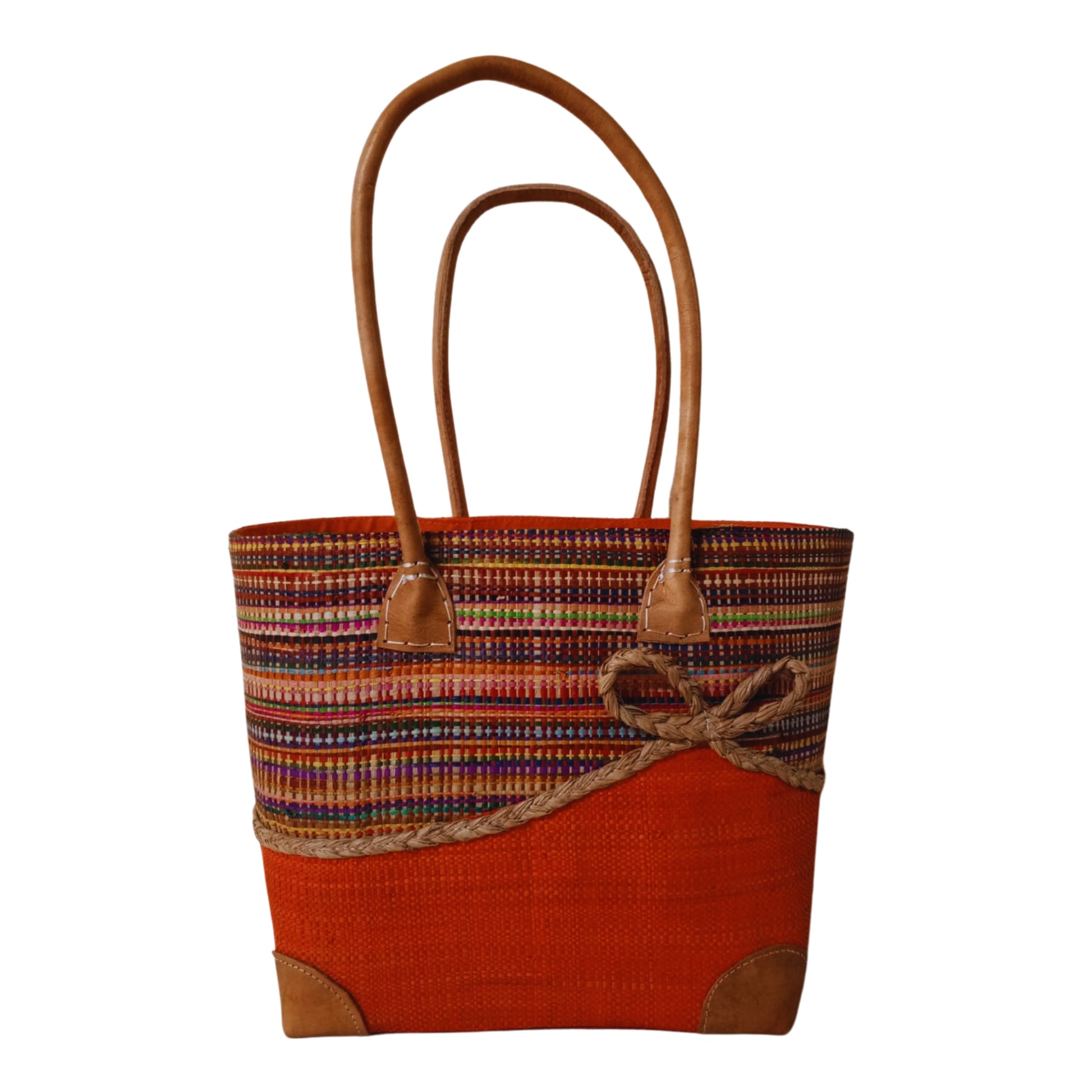 Orange woven basket with a bow at the front. Handmade in Madagascar. 