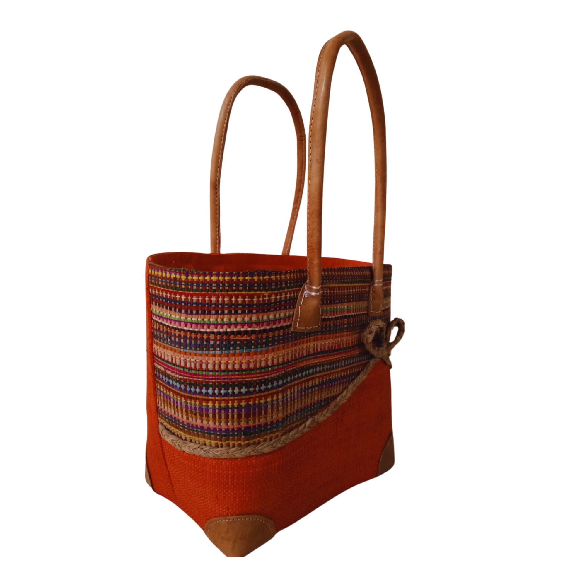 Orange woven basket with a bow at the front. Handmade in Madagascar. 