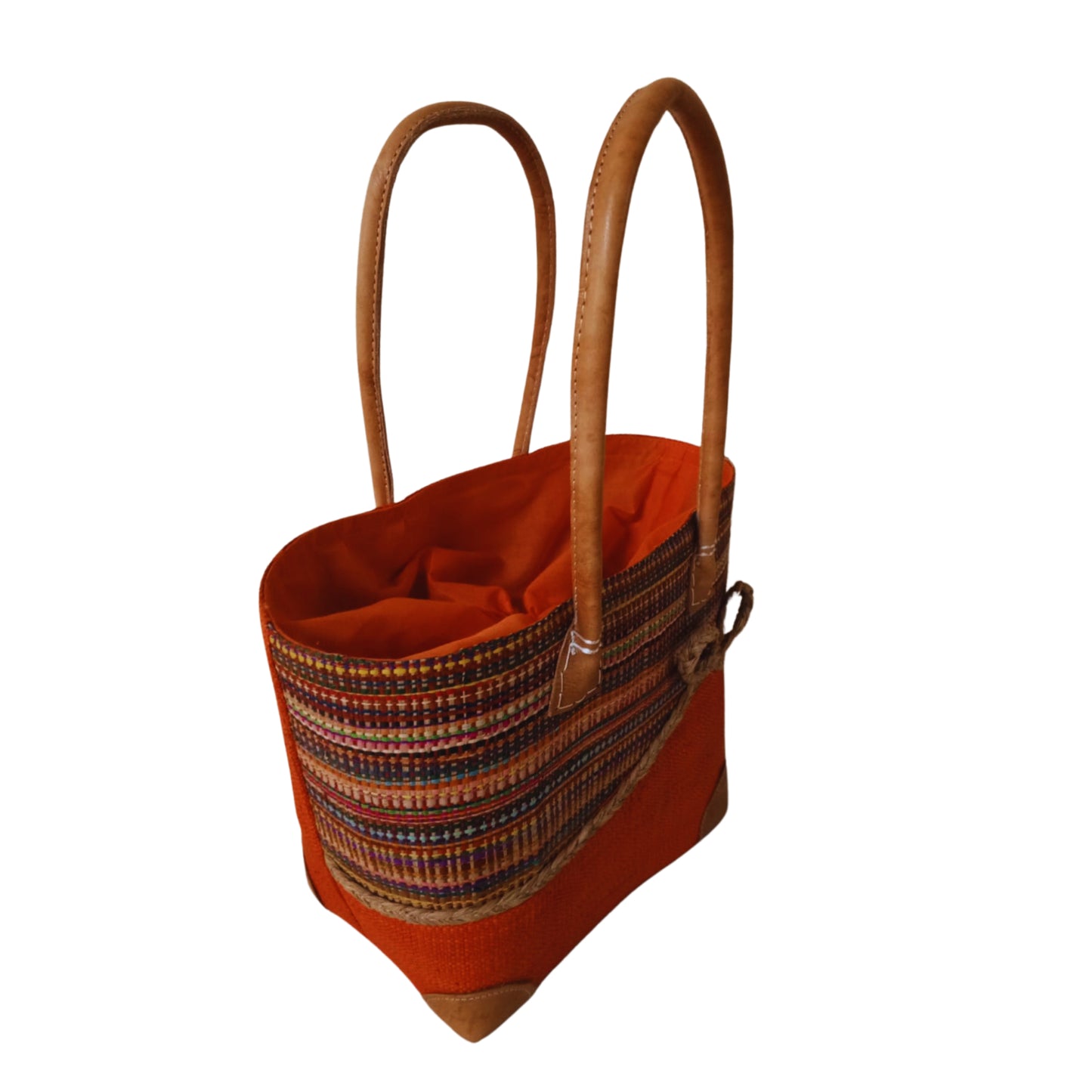 Orange woven basket with a bow at the front. Handmade in Madagascar. 