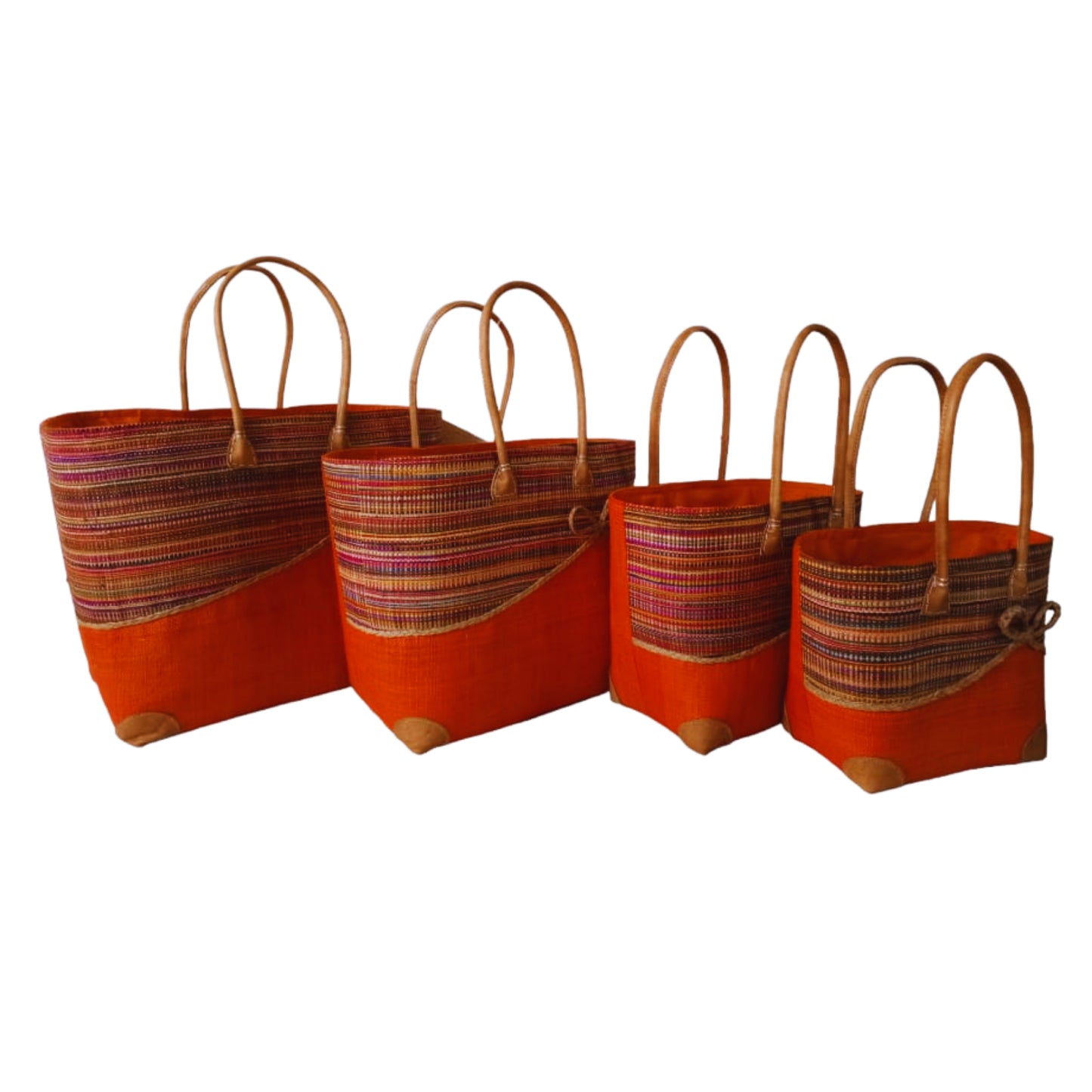 Orange woven basket with a bow at the front. Handmade in Madagascar. 