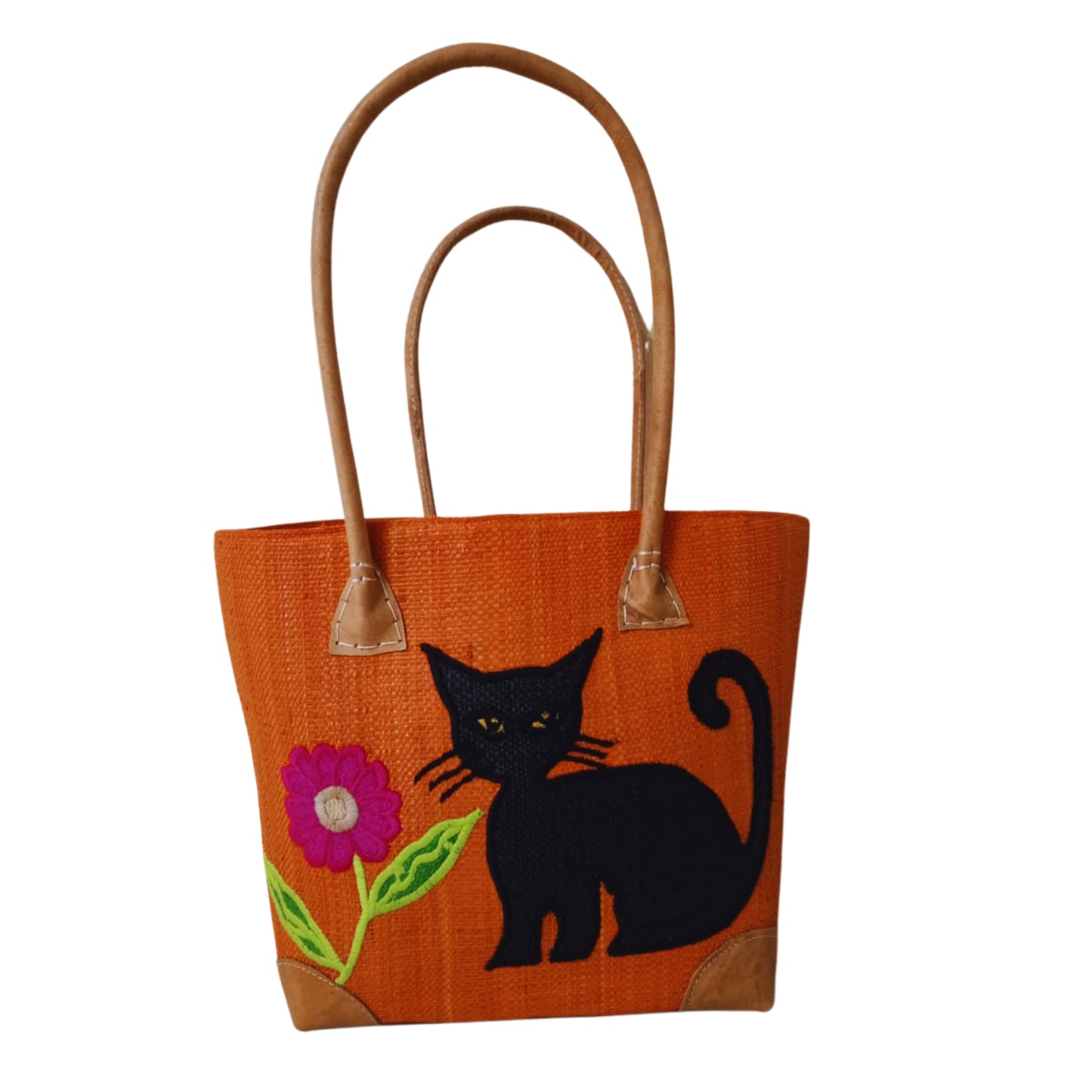 Orange woven basket with cat embroidery, leather handle and drawstring closure. handmade in Madagascar. 