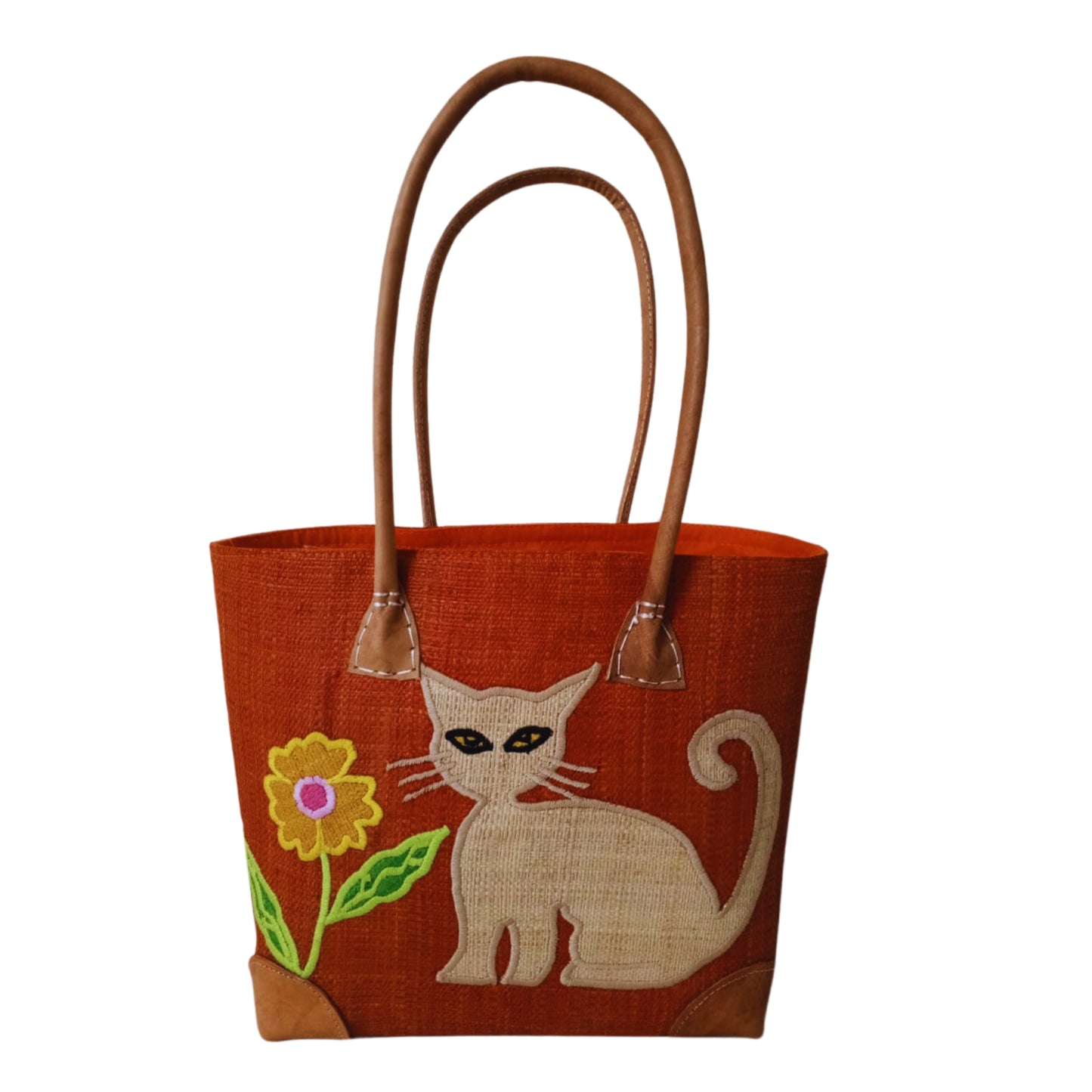 Orange woven basket with cat embroidery, leather handle and drawstring closure. handmade in Madagascar. 