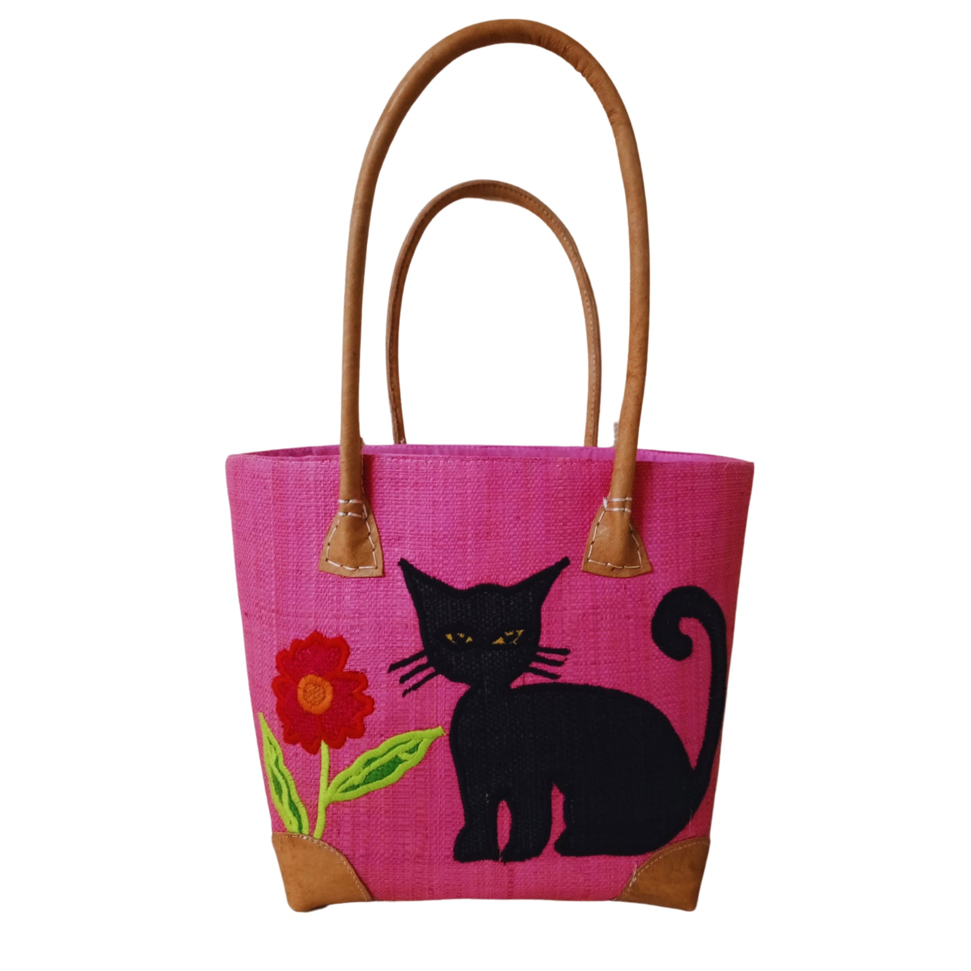 Pink woven basket with cat embroidery, leather handle and drawstring closure. handmade in Madagascar. 