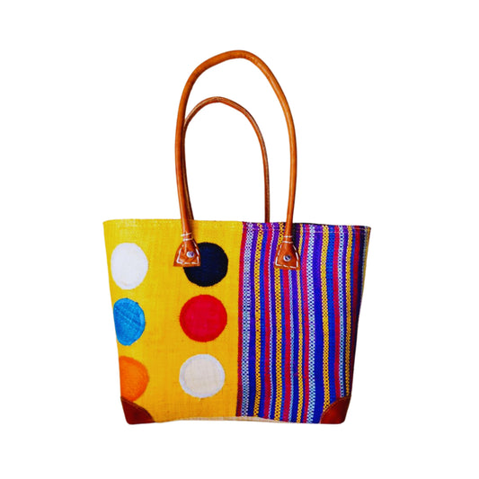 NatsNco handmade raffia, women,yellow basket with polka dots and stripes embroidery and leather handle & drawstring closure. Made in Madagascar