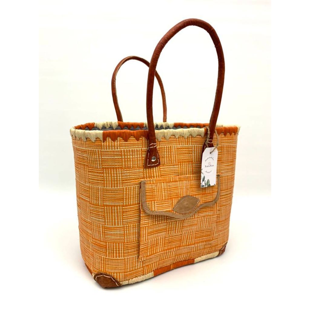 Orange raffia basket in 3 different sizes, with front and inside pockets & leather handle. Handmade in Madagascar with love. 